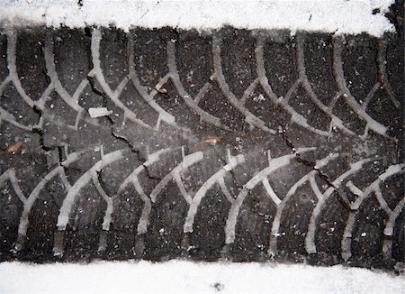 Print auto tire on asphalt on wet snow Stock Photo - Budget Royalty-Free & Subscription, Code: 400-05049064