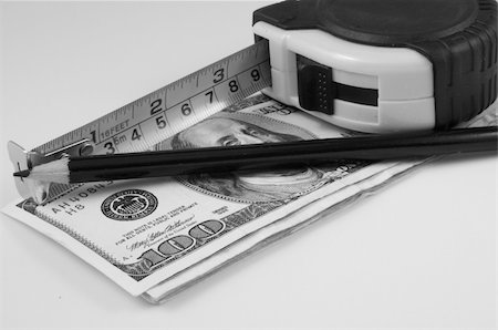simsearch:400-07919463,k - a measuring tape and a black pencil over bills of one hundred dollars Stock Photo - Budget Royalty-Free & Subscription, Code: 400-05049169