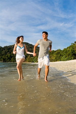 eyedear (artist) - loving young couple running along the beach happilly Stock Photo - Budget Royalty-Free & Subscription, Code: 400-05049221