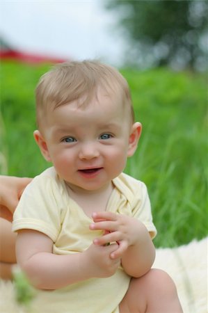 simsearch:400-04093413,k - Cute small boy in green grass - he smiles and has fun Stock Photo - Budget Royalty-Free & Subscription, Code: 400-05049344