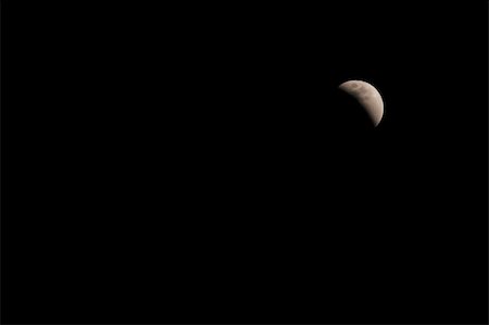 simsearch:400-04349997,k - The moon during a rare lunar eclipse. Foto de stock - Royalty-Free Super Valor e Assinatura, Número: 400-05040404