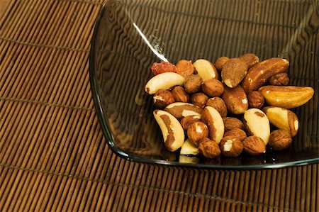 A mix of nuts in a glass dish Stock Photo - Budget Royalty-Free & Subscription, Code: 400-05040423
