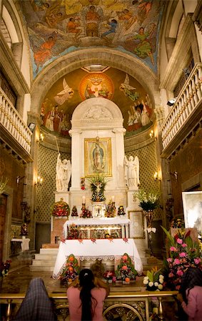 simsearch:400-06099898,k - Praying at Guadalupe Church, Guadalupe Shrine, Mexico City, Mexico Capilla del Pocito  This Shrine is at the top of the hill where the Virgin Mary first appeared to Juan Diego in 1531. Stock Photo - Budget Royalty-Free & Subscription, Code: 400-05040646