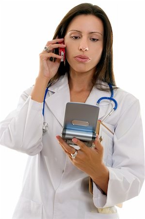 Healthcare worker giving medical information from a portable device over the phone. Stock Photo - Budget Royalty-Free & Subscription, Code: 400-05041084