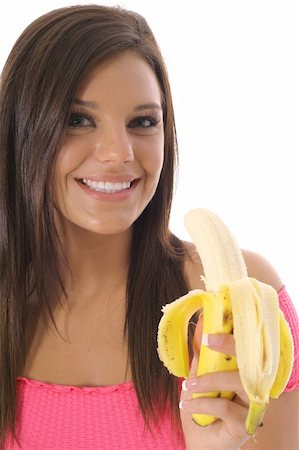 pretty women eating banana - model eating a healthy snack Photographie de stock - Aubaine LD & Abonnement, Code: 400-05041389