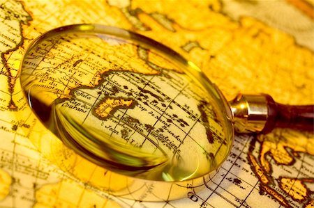 Antique Magnifying glass and antique map Stock Photo - Budget Royalty-Free & Subscription, Code: 400-05041409