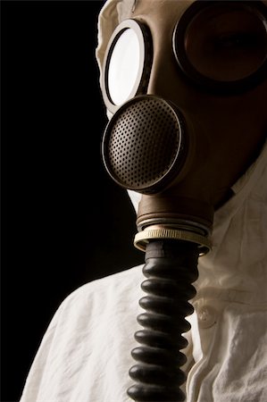 Person in gas mask on dark background Stock Photo - Budget Royalty-Free & Subscription, Code: 400-05041725