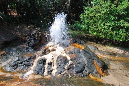 A sulfur water eruption showing rust stained deposit build up Fotografie stock - Microstock e Abbonamento, Codice: 400-05041853