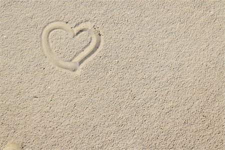 friendship symbols drawing photos - heart over sand can be used as a background Stock Photo - Budget Royalty-Free & Subscription, Code: 400-05041947