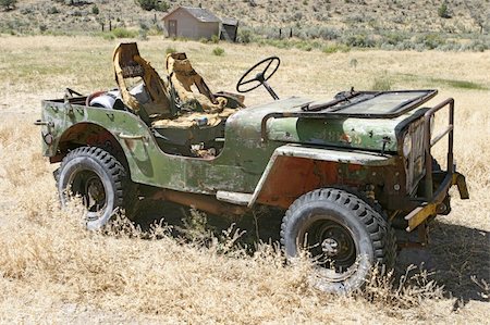 An old jeep that has been abandoned to rust and fall apart in a remote field near the Oregon desert. Stock Photo - Budget Royalty-Free & Subscription, Code: 400-05042638