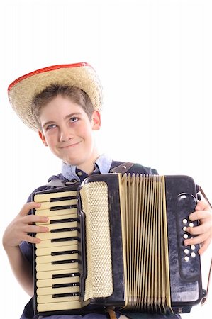 happy young boy playing an accordian vertical Photographie de stock - Aubaine LD & Abonnement, Code: 400-05042922