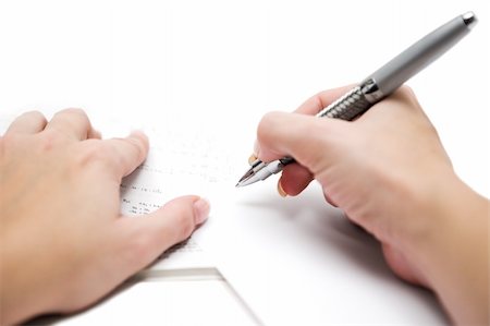 Copying mathematical formulas to a blank sheet of paper. Shallow depth of field White background. Stock Photo - Budget Royalty-Free & Subscription, Code: 400-05043035