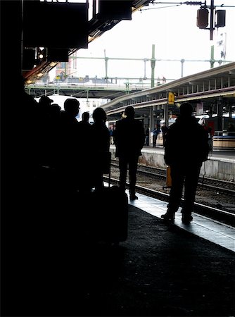 silhouette railway station - Passengers waiting at a railroad station for the next train. Stock Photo - Budget Royalty-Free & Subscription, Code: 400-05043122