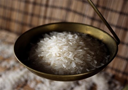 pontuse (artist) - Rice on a scale that could help to feed the world Stockbilder - Microstock & Abonnement, Bildnummer: 400-05043218