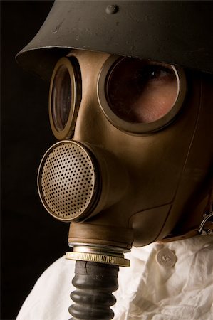 Person in gas mask on dark background Stock Photo - Budget Royalty-Free & Subscription, Code: 400-05043226