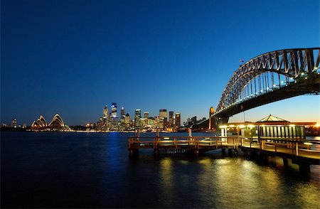 famous sydney landmarks - opera house, harbour bridge, sydney tower, port jackson. color reflections in water Stock Photo - Budget Royalty-Free & Subscription, Code: 400-05043240