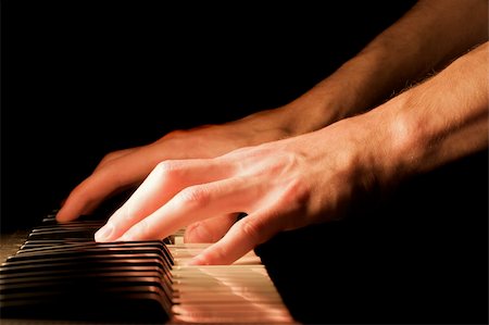 piano practice - Caucasian male's hand playing the piano Stock Photo - Budget Royalty-Free & Subscription, Code: 400-05043326