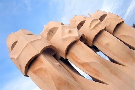 simsearch:400-05253939,k - Abstract chimneys atop the La Pedrera in Barcelona, Spain designed by famous architect Antonio Gaudi.  Built in 1912. Stock Photo - Budget Royalty-Free & Subscription, Code: 400-05043456