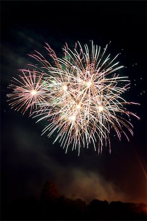 simsearch:400-06178928,k - Fireworks display/celebration out in the night sky. Stock Photo - Budget Royalty-Free & Subscription, Code: 400-05043458