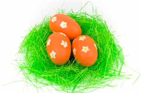 Three red easter eggs with green grass isolated on white Stock Photo - Budget Royalty-Free & Subscription, Code: 400-05043577