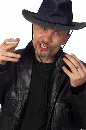 smoking and angry - very suspicious criminal looking man in black leather jacket Stock Photo - Budget Royalty-Free & Subscription, Code: 400-05043738