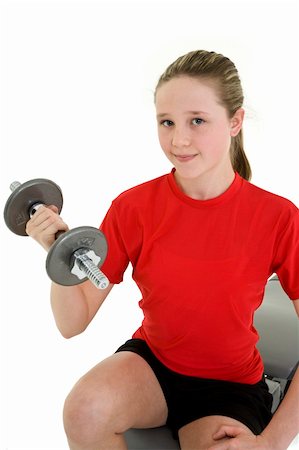 Caucasian preteen female lifting weights using a dumbbell on a white background Stock Photo - Budget Royalty-Free & Subscription, Code: 400-05054031