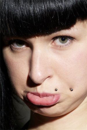 portrait of a woman with piercing and pout Photographie de stock - Aubaine LD & Abonnement, Code: 400-05054145
