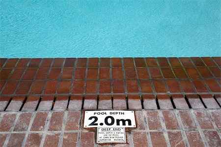 deserted swimming pool - pool depth sign at the edge of the swimming pool knysna western cape province south africa Stock Photo - Budget Royalty-Free & Subscription, Code: 400-05054162