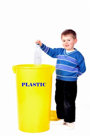 segregation - Young boy recycling plastic bottle Stock Photo - Budget Royalty-Free & Subscription, Code: 400-05054215