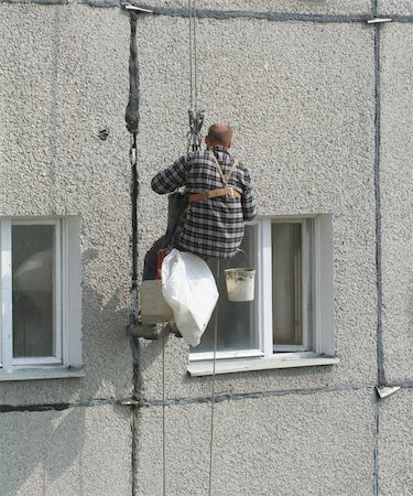 suspension harness - renovation worker on a block of flats Stock Photo - Budget Royalty-Free & Subscription, Code: 400-05054252