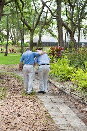 elderly father son not child - Adult son walking his senior grandfather in the park.  Vertical view with room for text. Stock Photo - Budget Royalty-Free & Subscription, Code: 400-05054274