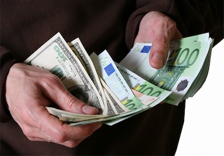 sign for european dollar - Man's hands hold Euro and dollars banknotes money Stock Photo - Budget Royalty-Free & Subscription, Code: 400-05054511