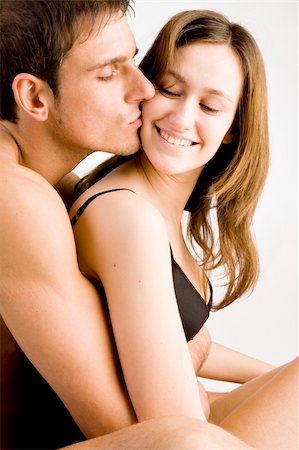 simsearch:400-04482792,k - Young adult couple in the studio hugging Stock Photo - Budget Royalty-Free & Subscription, Code: 400-05054740
