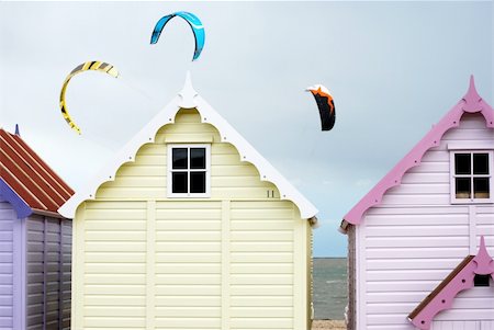 pastel colors beach - Pretty pastel beach huts with kites flying in the sky behind them Stock Photo - Budget Royalty-Free & Subscription, Code: 400-05054887