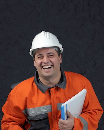 smiling miner with file in hand Stock Photo - Budget Royalty-Free & Subscription, Code: 400-05055112