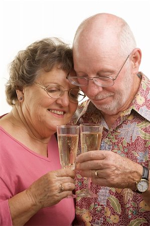 simsearch:400-04522125,k - Happy Senior Couple toasting with Champagne glasses. Stock Photo - Budget Royalty-Free & Subscription, Code: 400-05055334