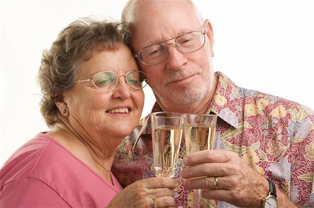 simsearch:400-04522125,k - Happy Senior Couple toasting with Champagne glasses. Stock Photo - Budget Royalty-Free & Subscription, Code: 400-05055335