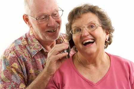 simsearch:400-04522125,k - Senior Couple using a cell phone. Stock Photo - Budget Royalty-Free & Subscription, Code: 400-05055332
