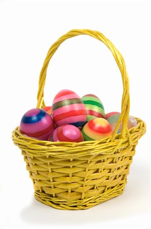 Couple of colorful Easter Eggs in a yellow basket. Fotografie stock - Microstock e Abbonamento, Codice: 400-05056067