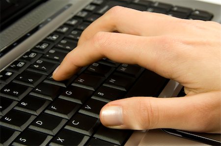 Human hand on black laptop keyboard Stock Photo - Budget Royalty-Free & Subscription, Code: 400-05056375