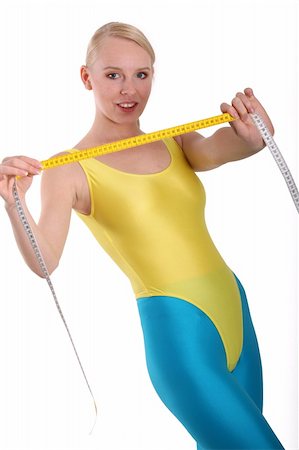 Woman in fitness clothes shows measuring tape Stock Photo - Budget Royalty-Free & Subscription, Code: 400-05056525