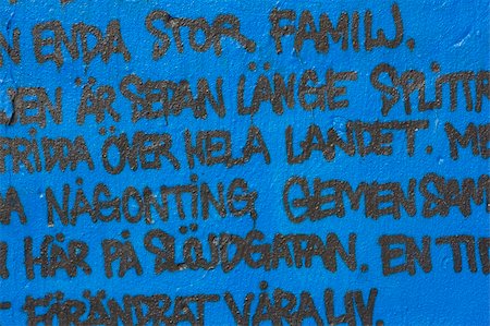 spritzlack - graffiti on the blue wall (Swedish text) Stockbilder - Microstock & Abonnement, Bildnummer: 400-05057061