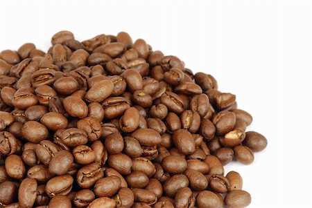 Detail of freshly roasted coffee beans heap isolated Stock Photo - Budget Royalty-Free & Subscription, Code: 400-05057091