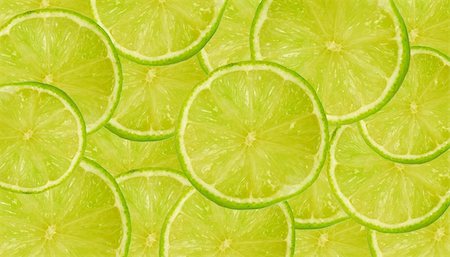 Background of fresh juicy lime slices on a large heap Stock Photo - Budget Royalty-Free & Subscription, Code: 400-05057164