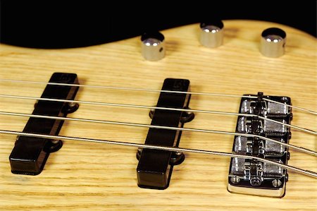 simsearch:400-08134650,k - wood finish four string electric bass guitar Stock Photo - Budget Royalty-Free & Subscription, Code: 400-05057211