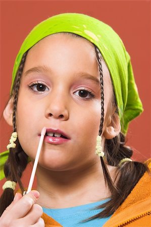 young pretty child applying make-up Stock Photo - Budget Royalty-Free & Subscription, Code: 400-05057432