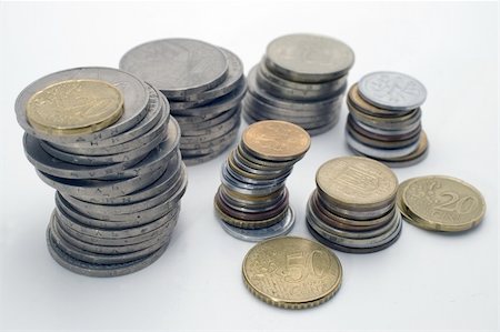 Stacks of coins, isolated on white background. Stockbilder - Microstock & Abonnement, Bildnummer: 400-05058227
