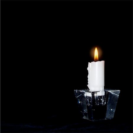Candle in the dark lit for: ? peace ? love ? understanding ? the world ? you and me The black background is ideal for your own text, and as it is 100% pure black you can simply add all the space you want on any side of the candle. Stock Photo - Budget Royalty-Free & Subscription, Code: 400-05058325