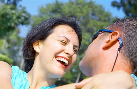 a portrait of attractive couple in summer environment Stock Photo - Budget Royalty-Free & Subscription, Code: 400-05058748