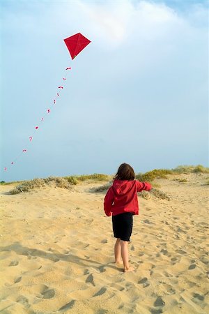 girl on beach and a red kite Stock Photo - Budget Royalty-Free & Subscription, Code: 400-05058887